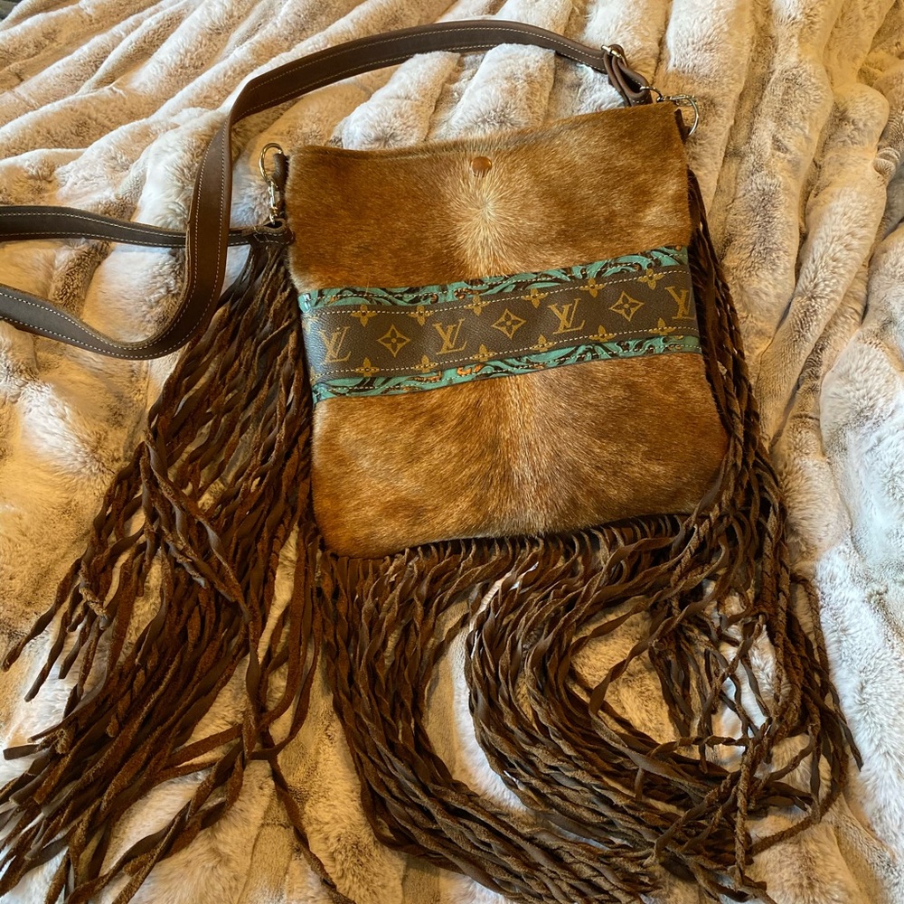 Hair on hide crossbody with LV accent